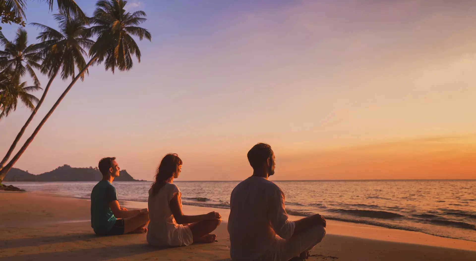 Three people meditating on a beach at sunset, with palm trees and calm ocean waves in the background.