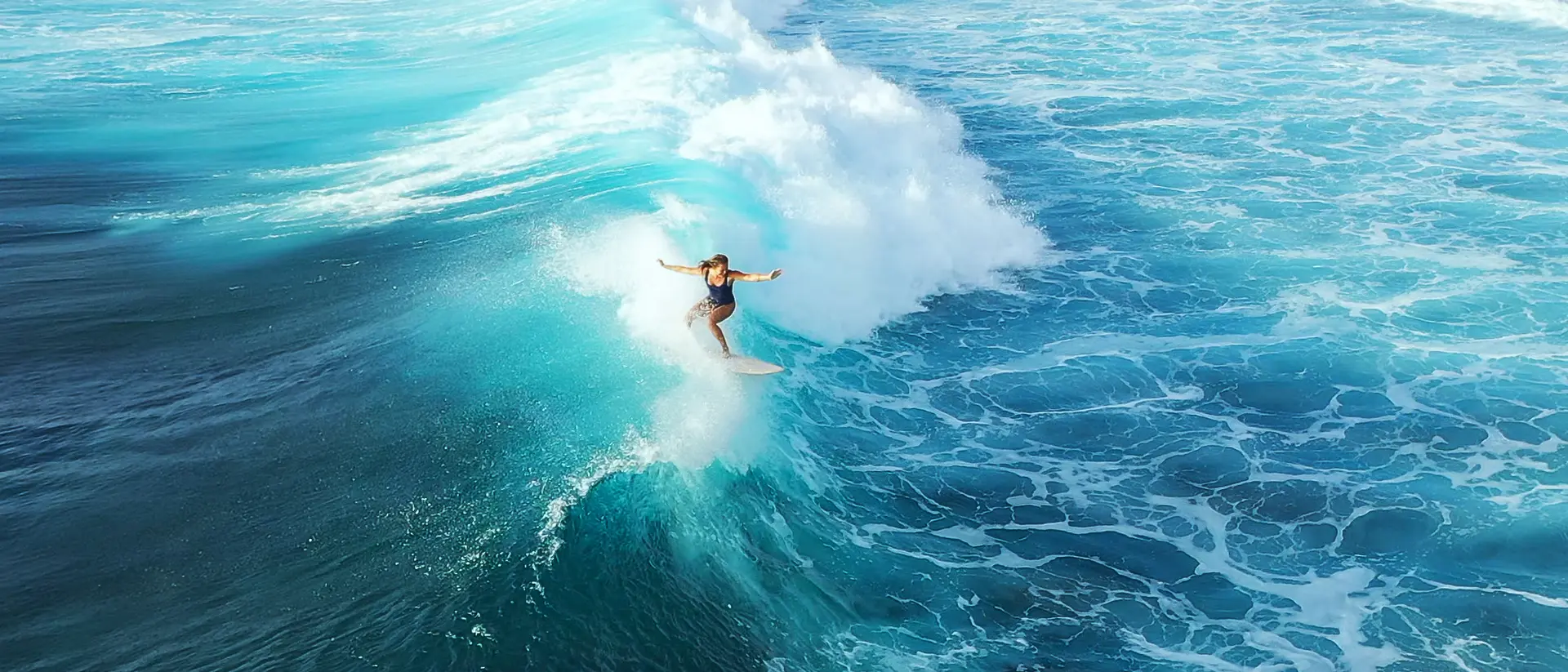 Lagoon in Maldives Surfer woman riding on the blue ocean
