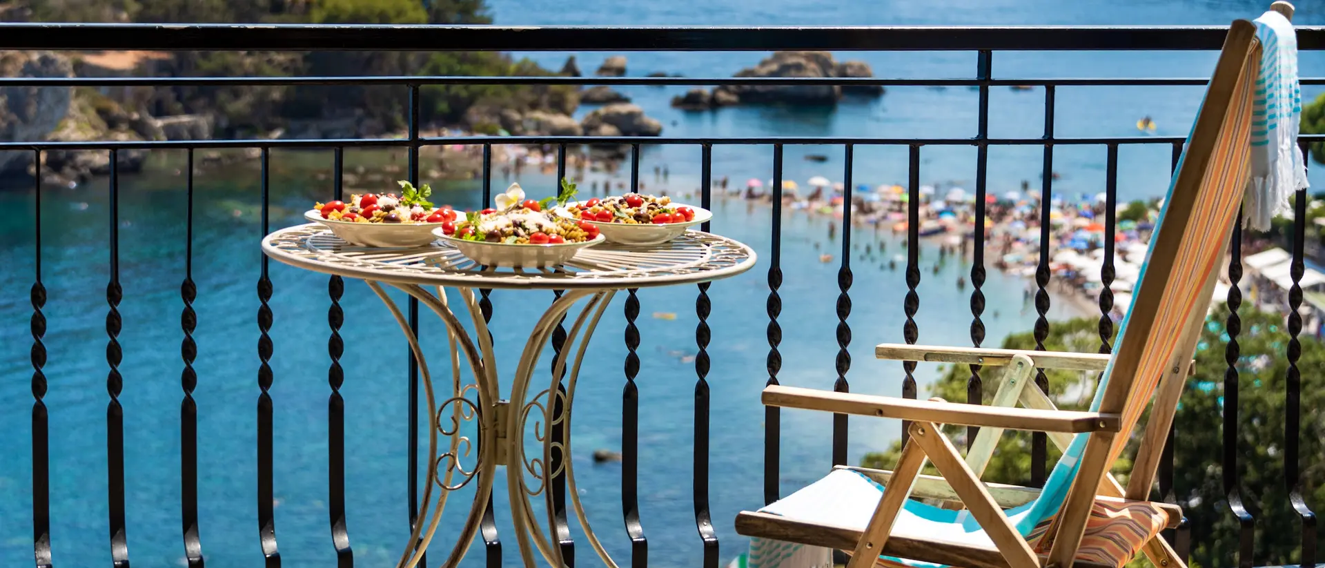 Exquisite Sicilian pasta served on a sun terrace with incredible sea view