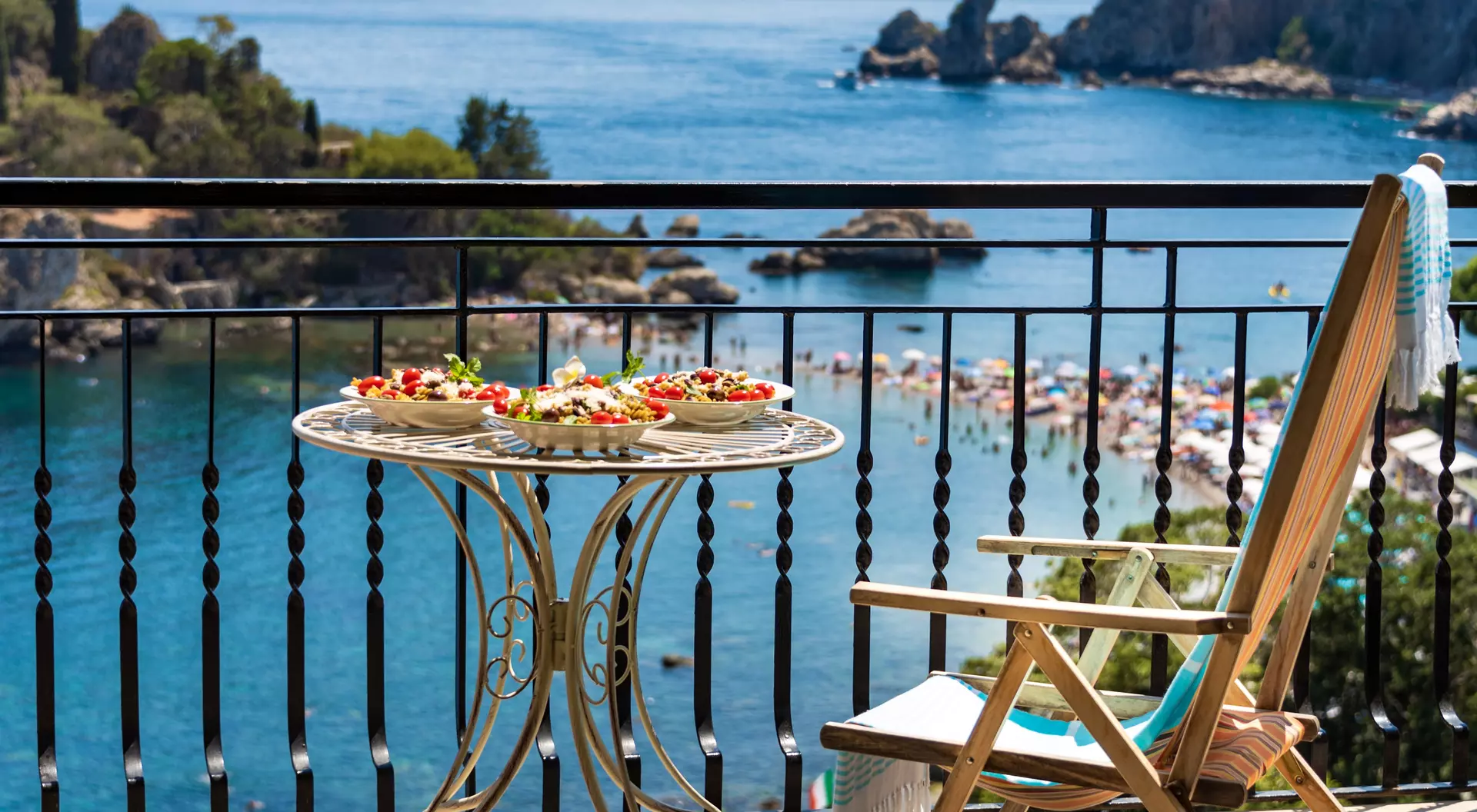 Sicily, Italy Exquisite Sicilian pasta served on a sun terrace with incredible sea view