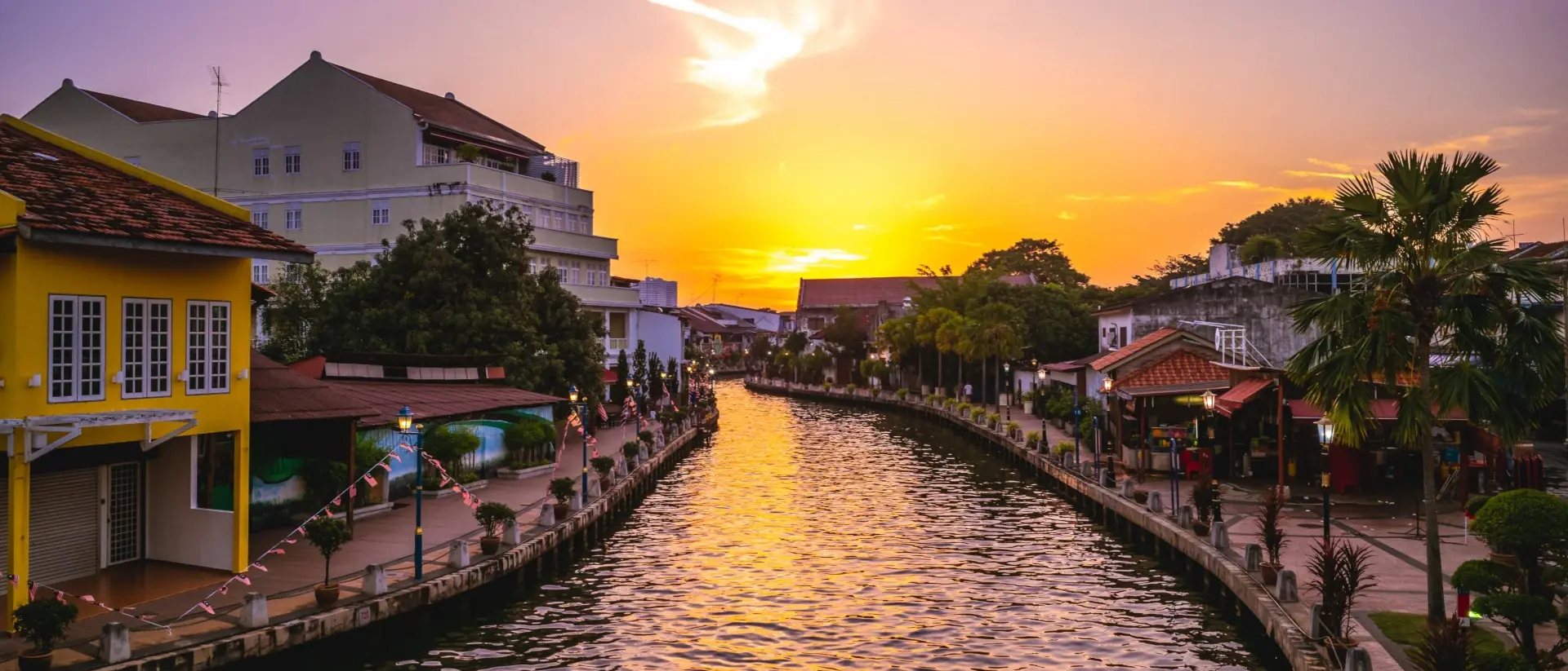 Melaka Tengah District River canal and the old town in Melaka, or Malacca, Malaysia at dusk