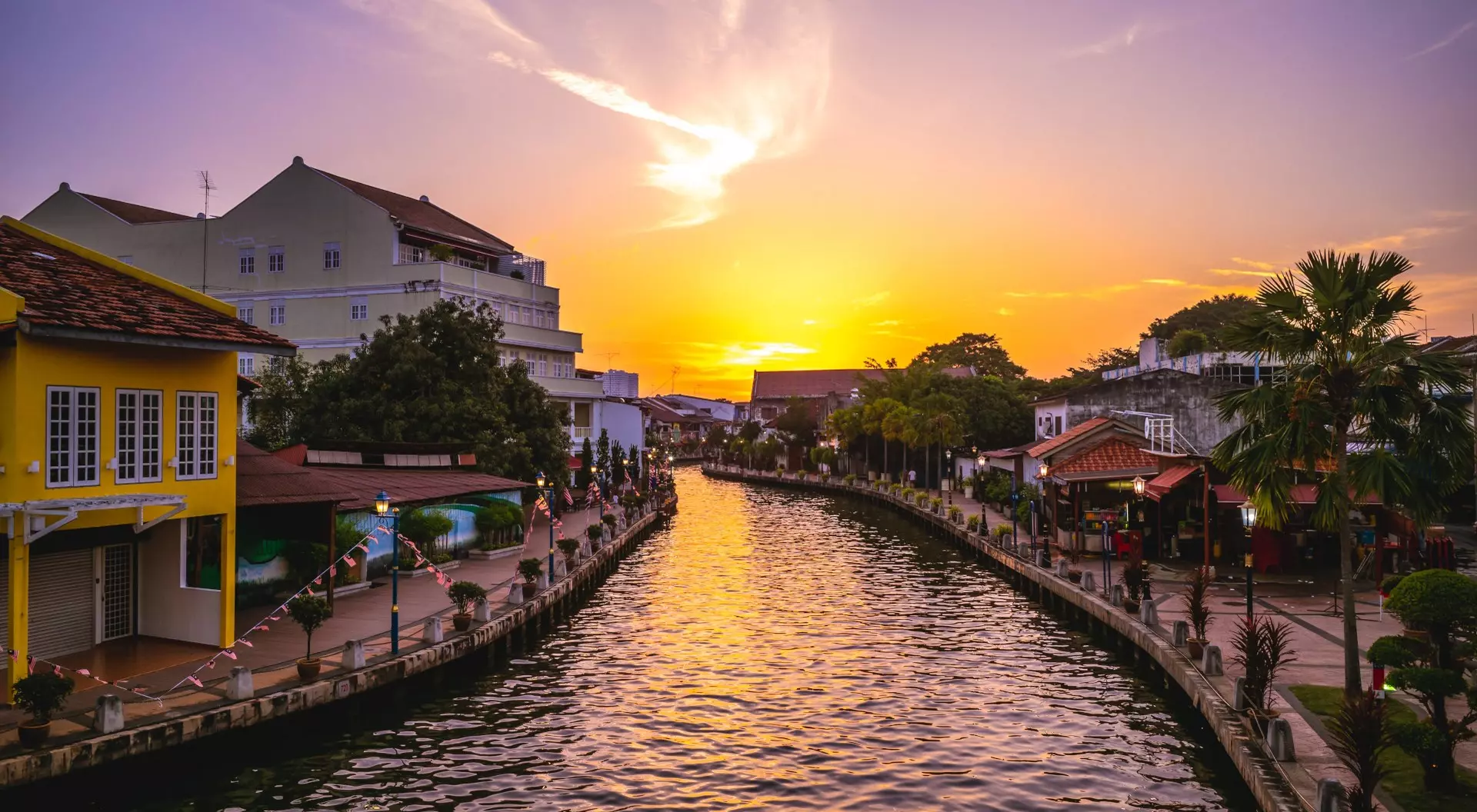 Melaka Tengah District River canal and the old town in Melaka, or Malacca, Malaysia at dusk