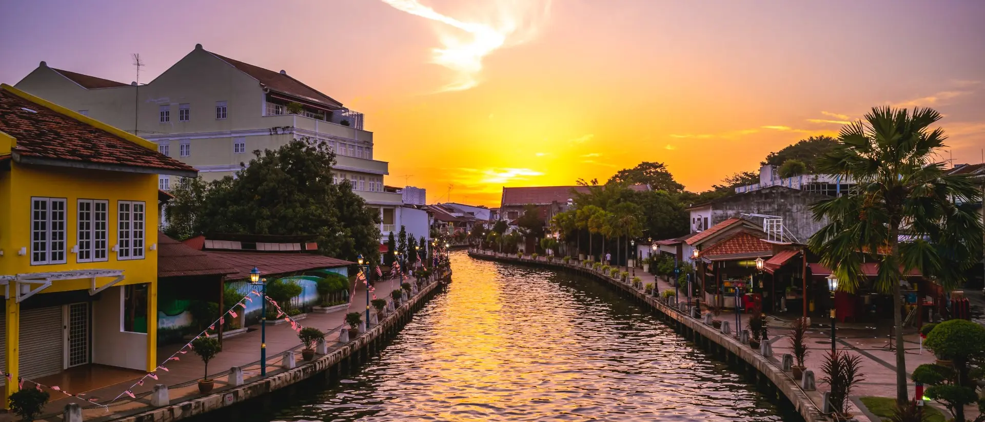 Melaka Tengah District River canal and the old town in Melaka, or Malacca, Malaysia at dusk