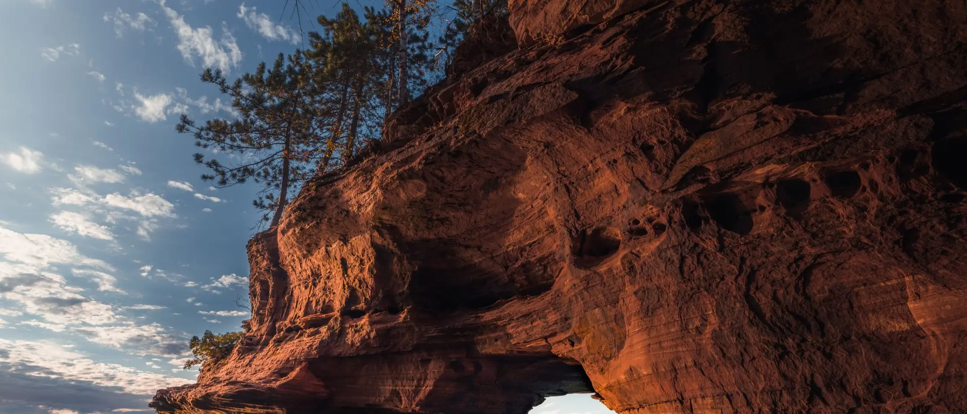 Apostle Island Sea Caves A lone kayaker exits a sea cave on The Apostle Island National Lakeshore in Wisconsin