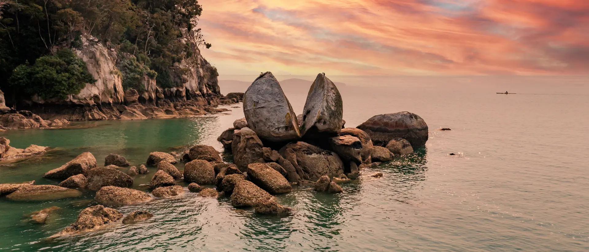 Famous rock and tourist site in national park with sunset in the background