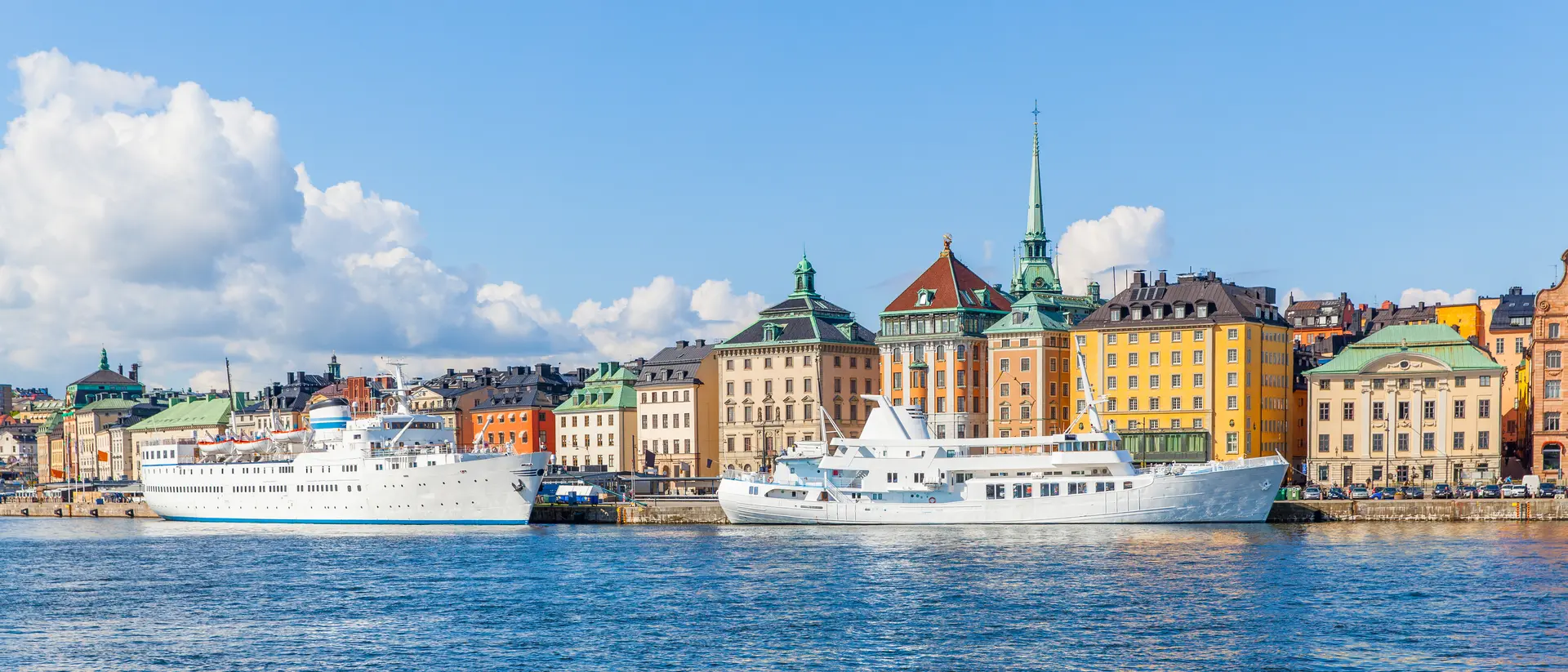 Gamla Stan Panoramic view of waterfront with moored ships in the Old Town (Gamla stan)