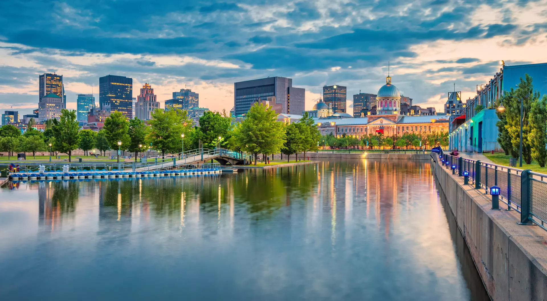 Montreal, Canada Waterfront of the Vieux Port and overlooking the city skyline and bonsecours market building