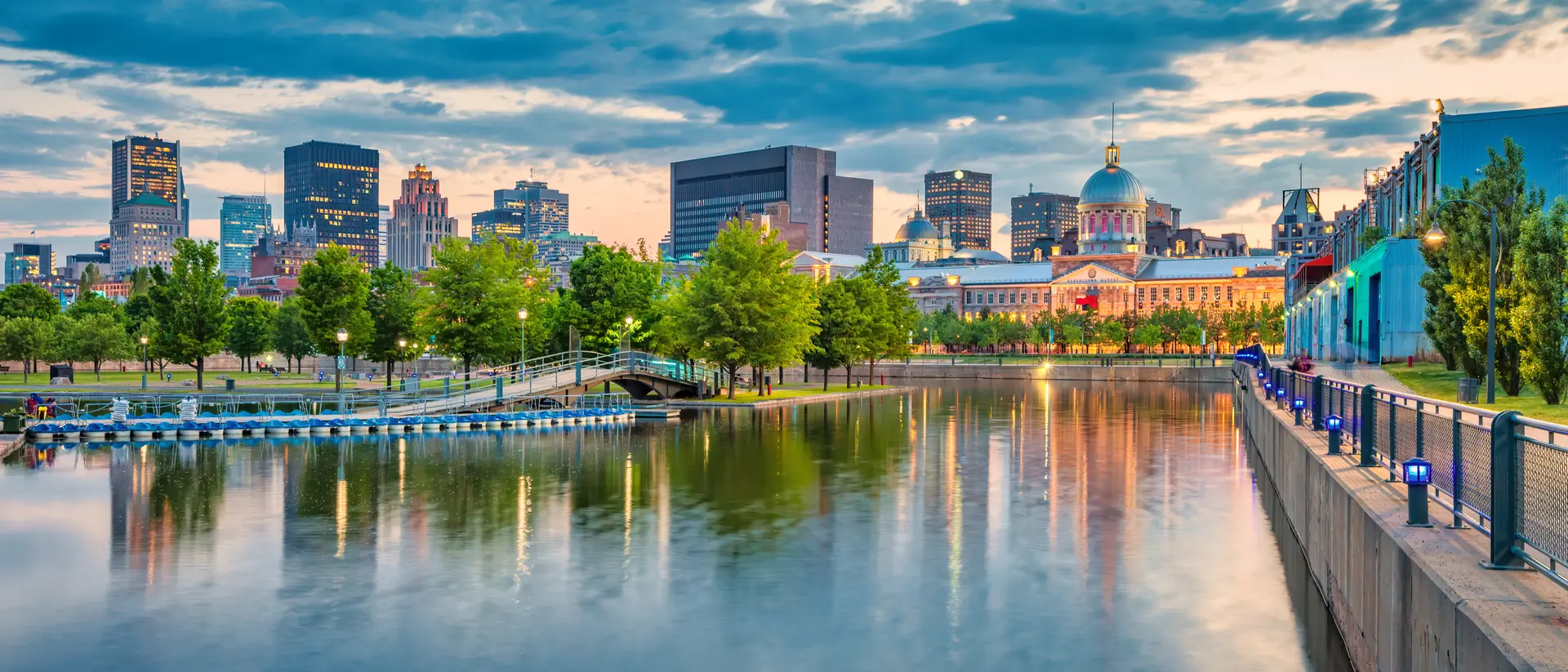 Montreal, Canada Waterfront of the Vieux Port and overlooking the city skyline and bonsecours market building