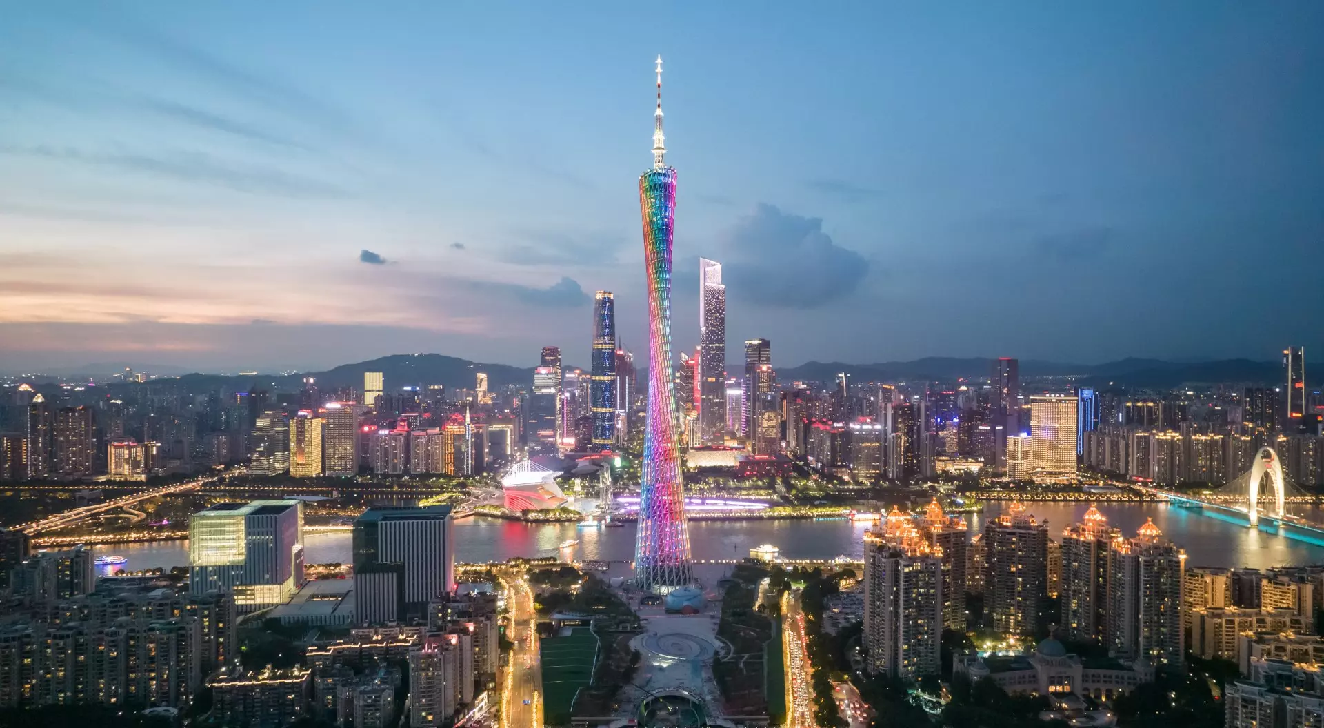 Evening lights view of Guangzhou including Canton Tower along the Pearl River