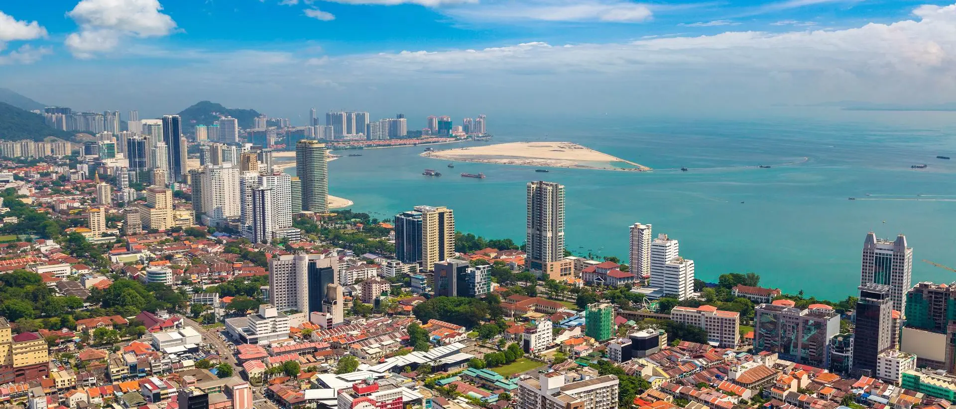 Panoramic aerial view of the city of Georgetown, with the straits of Malacca and Indian Ocean in the background
