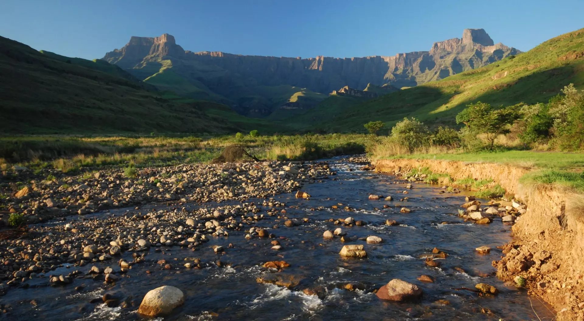 Clear morning looking up-river to the Ampitheatre, Northern Drakensberg Mountain Range,