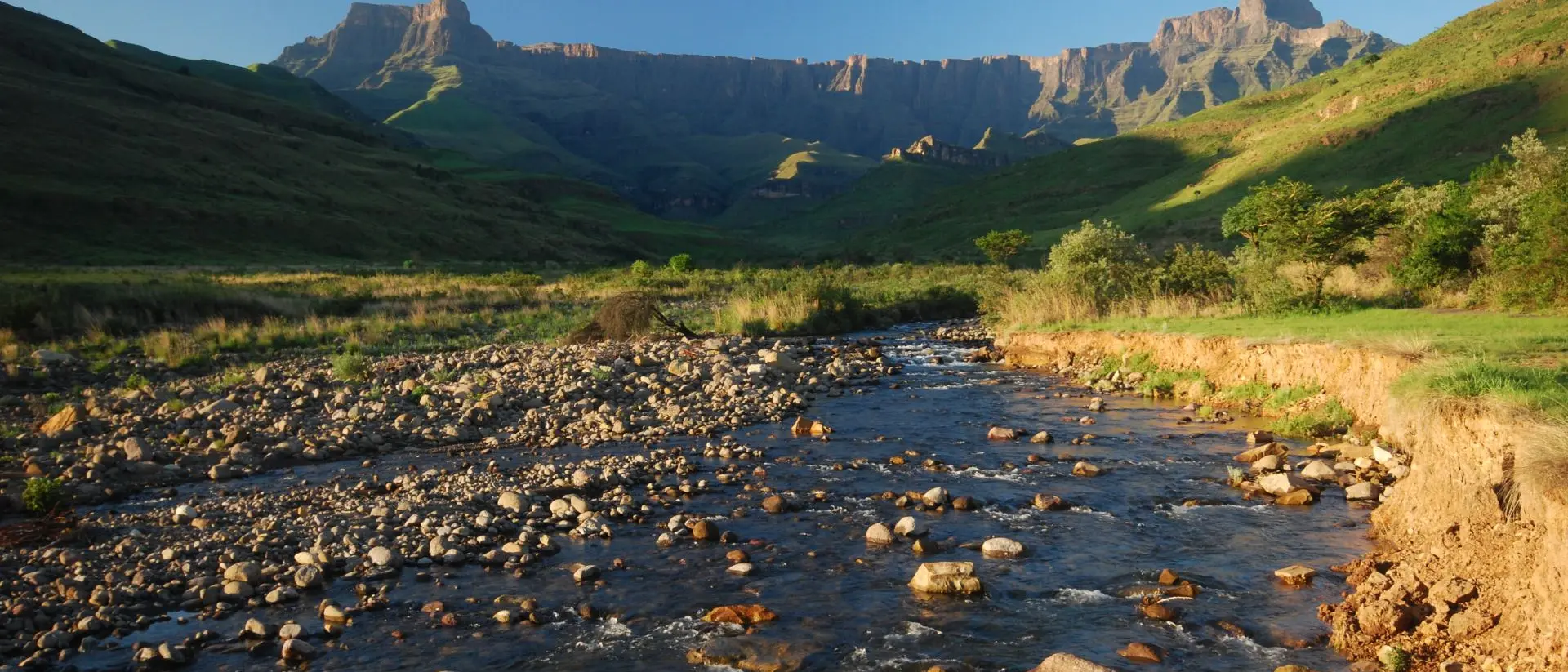 Clear morning looking up-river to the Ampitheatre, Northern Drakensberg Mountain Range,
