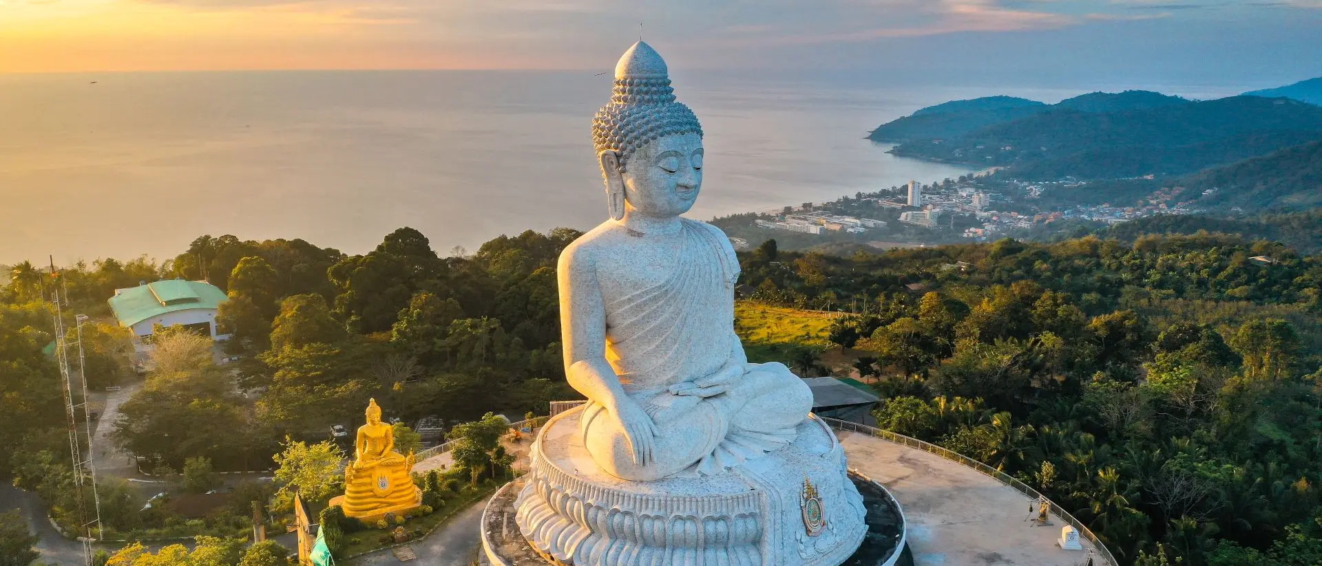 Aerial view of Big Buddha viewpoint at sunset on Phuket with a view of the water and coast below