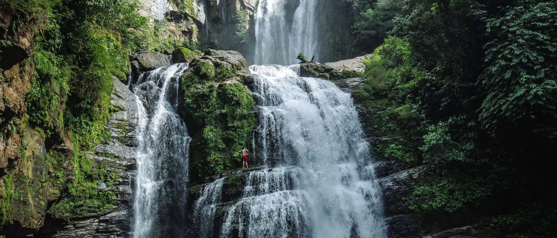 Manuel Antonio National Park, Costa Rica Tall beautiful waterfalls in a lush green rainforest