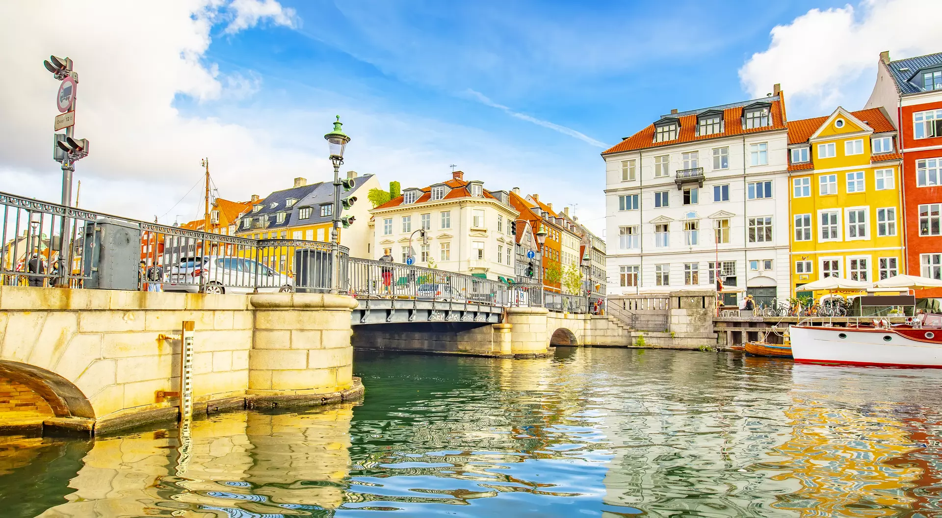 Coloful houses sit on the canal of the old town skyline in Copenhagen