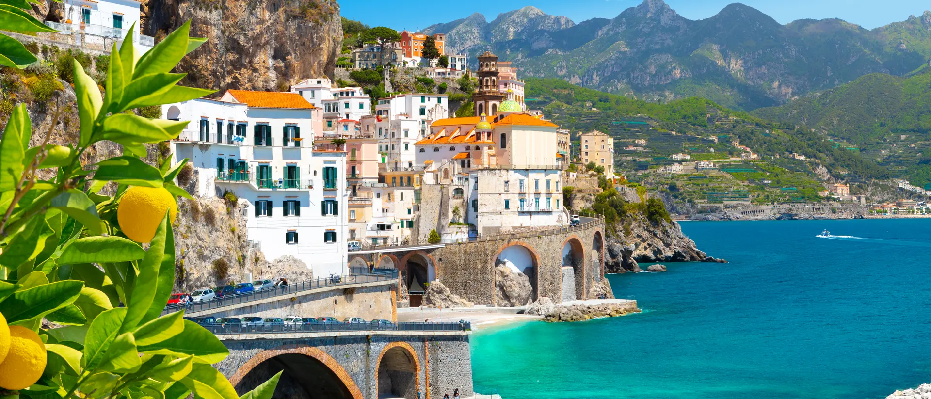Beautiful view of Amalfi on the Mediterranean coast with lemons in the foreground