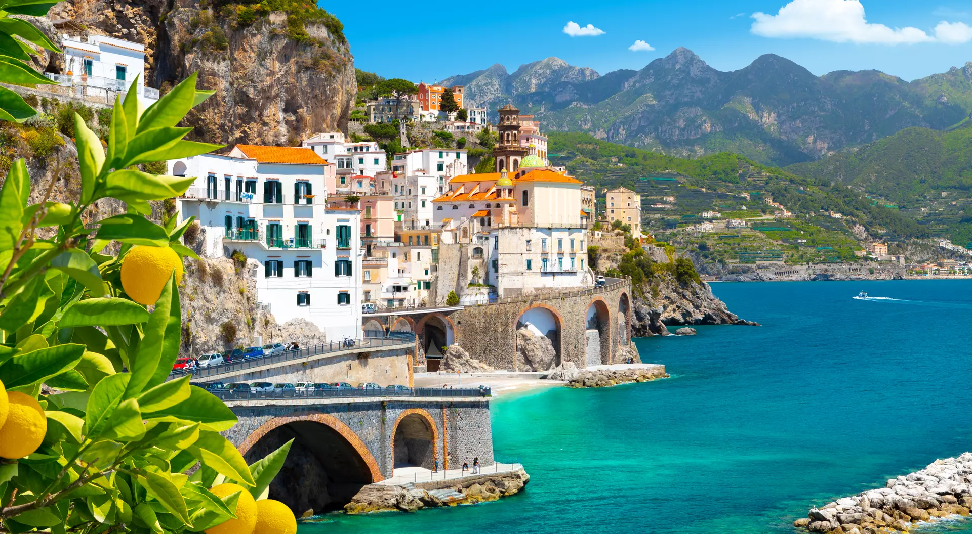 Beautiful view of the Mediterranean coast with lemons in the foreground