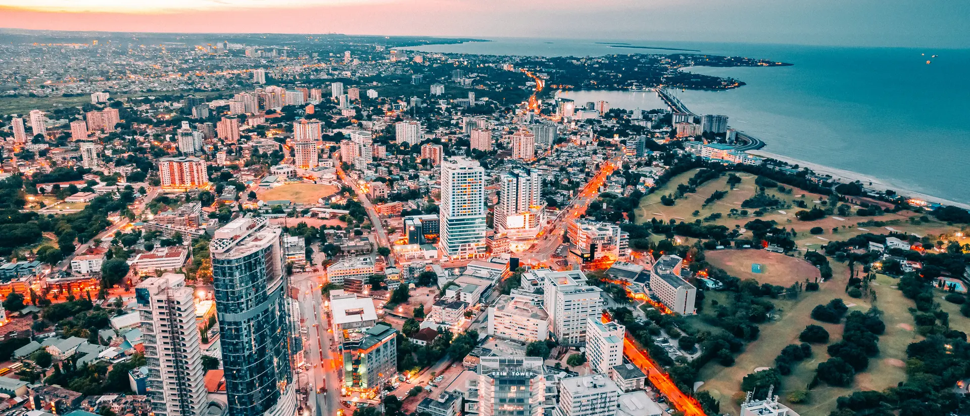 A Drone shot of the capital city of Tanzania, Dar es salaam, view from above. The Brand. Found in East Africa. The city centre located in Posta showing ocean view and the whole city