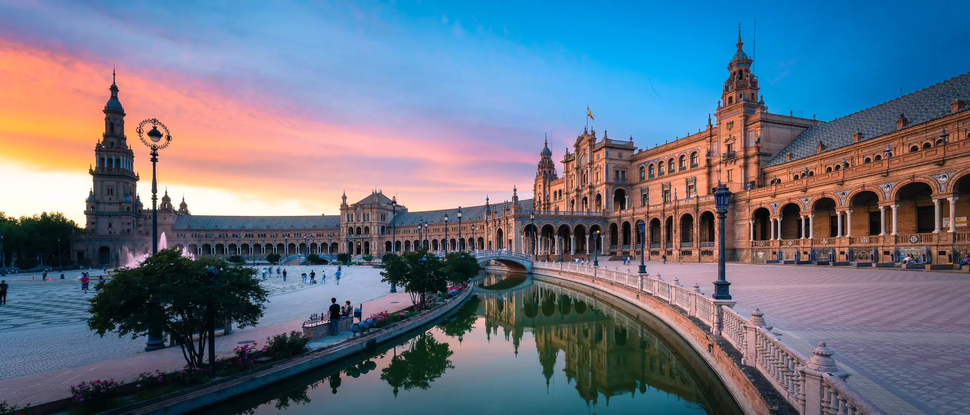 Plaza de España, Sevilla, Andalusia Famous plaza with Dramatic Colorful Clouds at Sunset,
