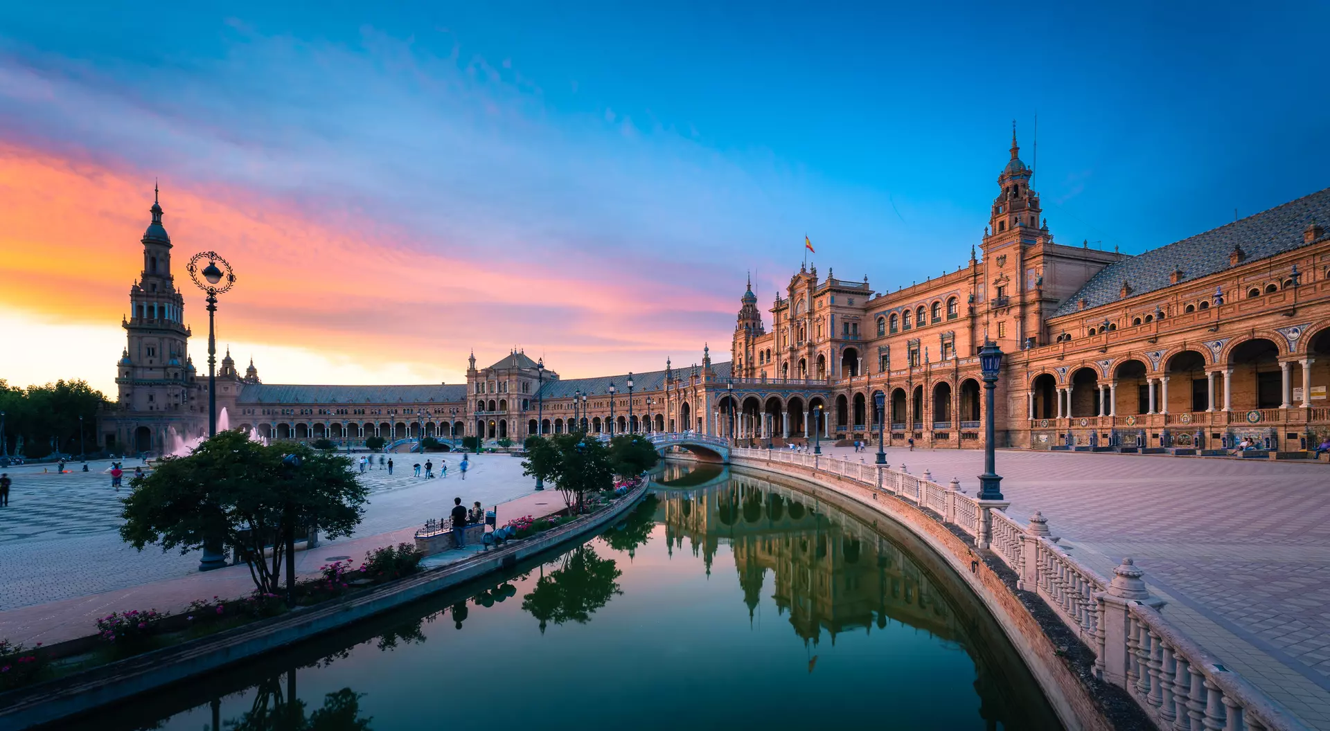 Plaza de España, Sevilla, Andalusia Famous plaza with Dramatic Colorful Clouds at Sunset,