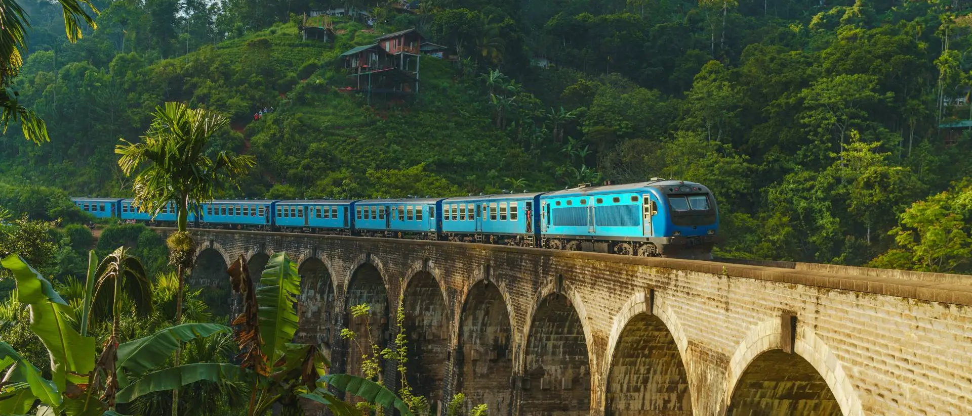 Nine Arch Bridge in Demodara, Ella Iconic train passing over Nine Arch Bridge in Demodara, Ella, Sri Lanka