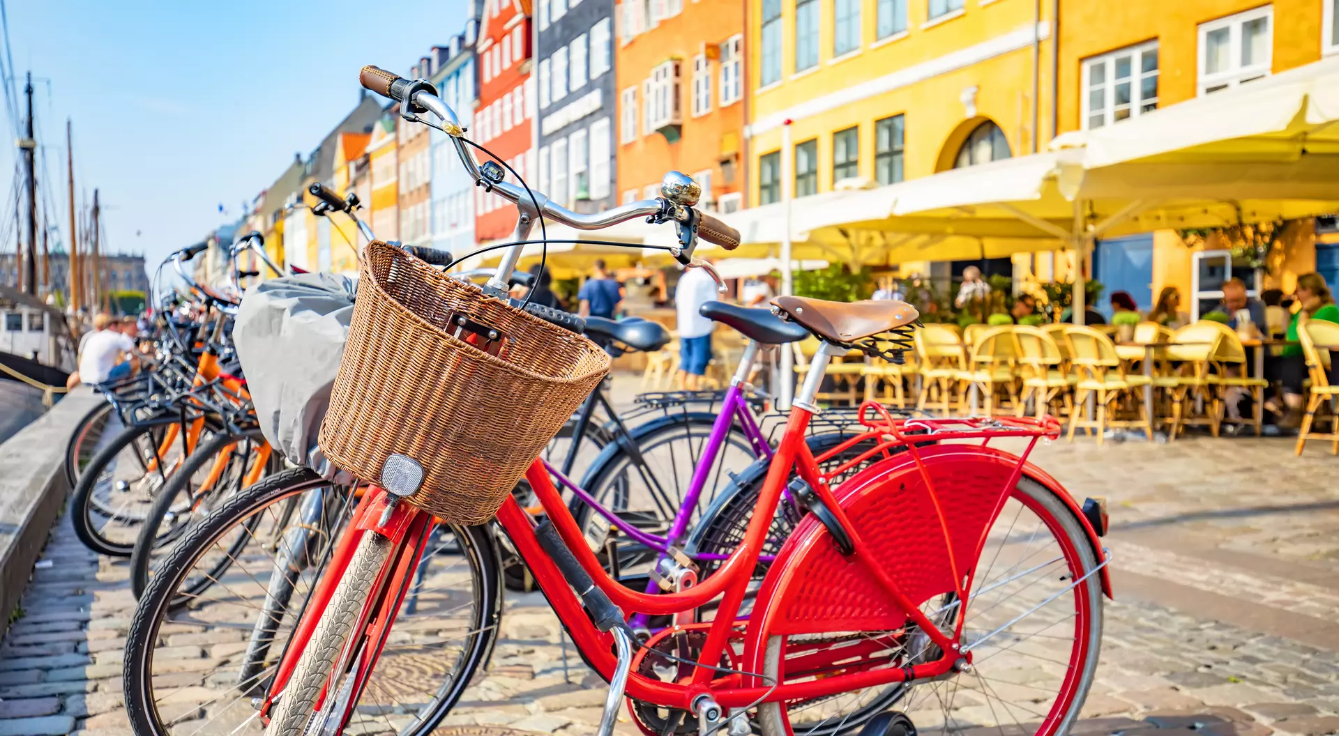 Scenic view of Copenhagen old town, Nyhavn harbor, selective focus on a front bicycle