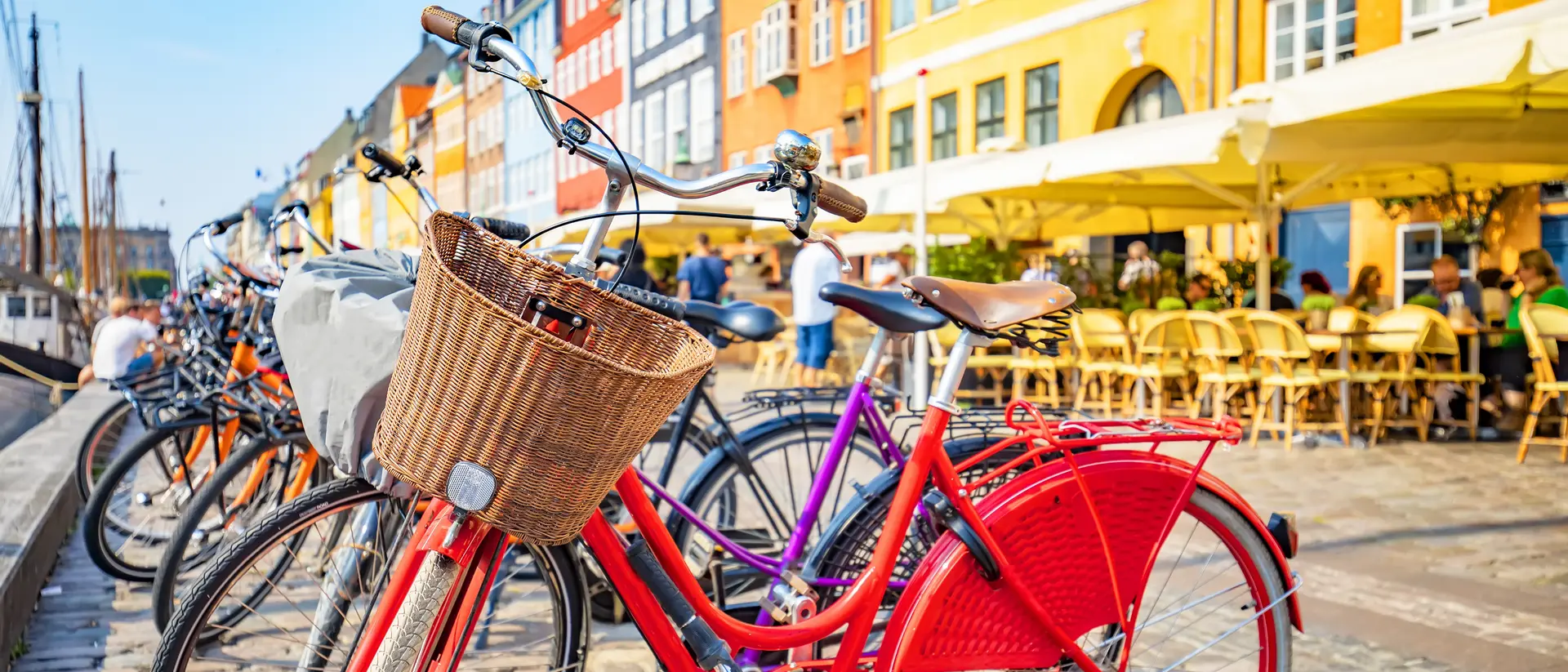 Scenic view of Copenhagen old town, Nyhavn harbor, selective focus on a front bicycle