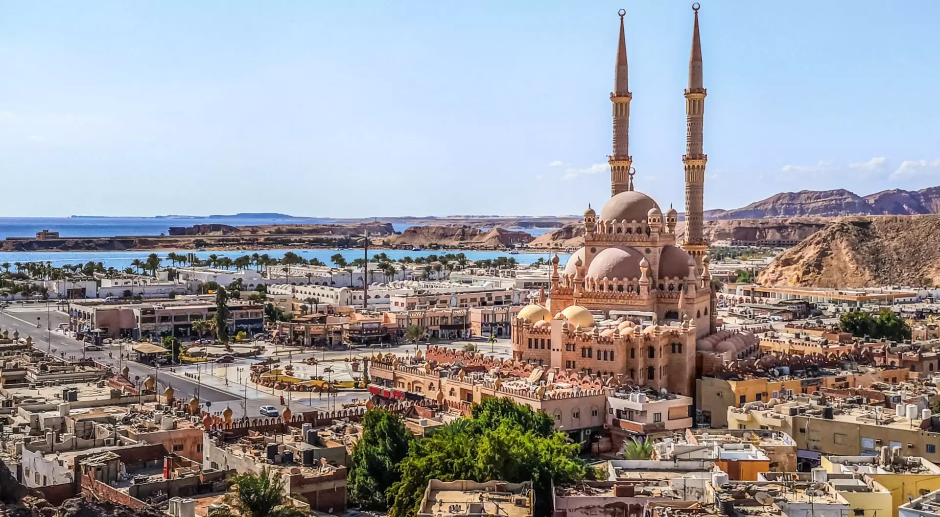 Top view of the old town of Sharm El Sheikh, Egypt. Beautiful cityscape with exotic egyptian architectures and Al Sahaba Mosque against the backdrop of the Red Sea