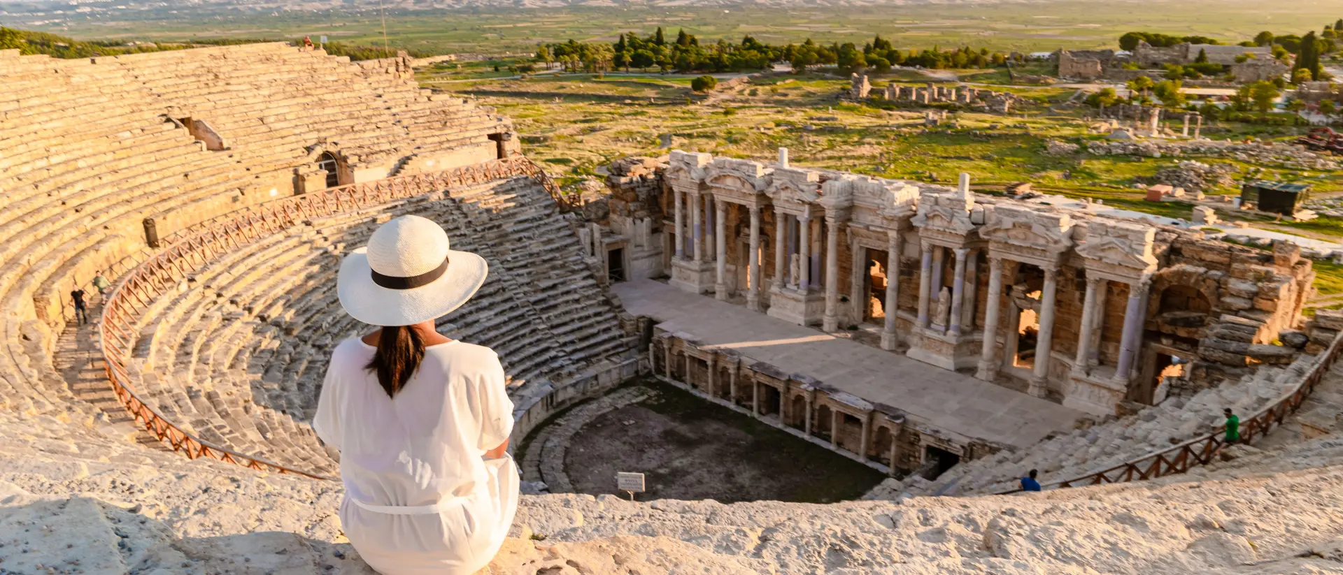 Hierapolis ancient city Pamukkale Turkiye, a young watching the sunset by the ruins Unesco site