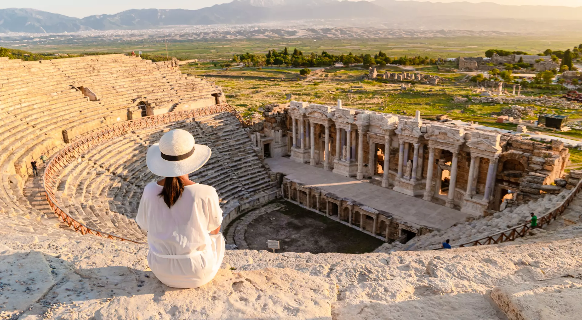 Hierapolis ancient city Pamukkale Turkiye, a young watching the sunset by the ruins Unesco site