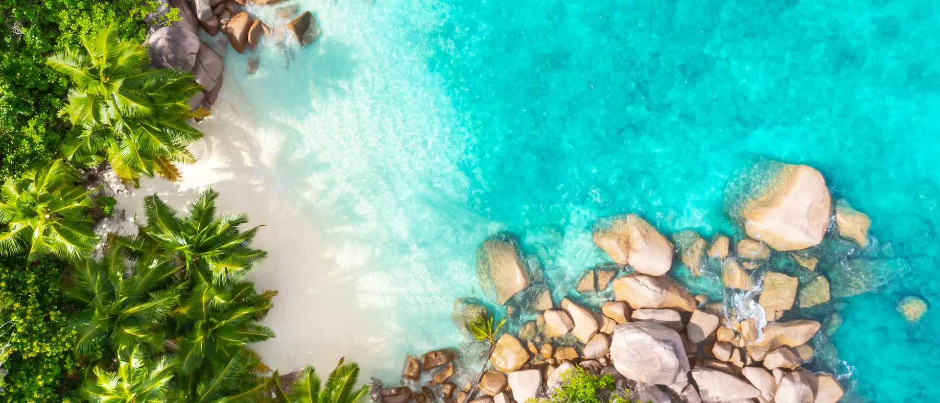 Praslin Island Aerial view from above of beach and bright blue waters of coastline