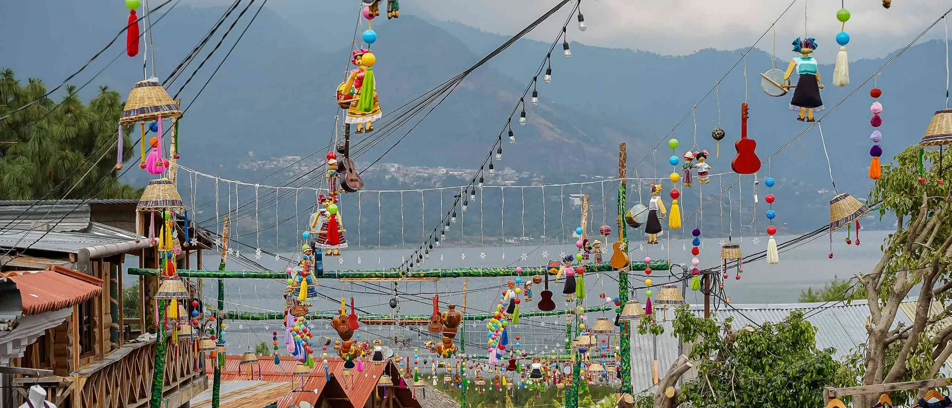 Hanging umbrellas in the colorful streets of San Juan La Laguna at Lake Atitlan, Guatemala