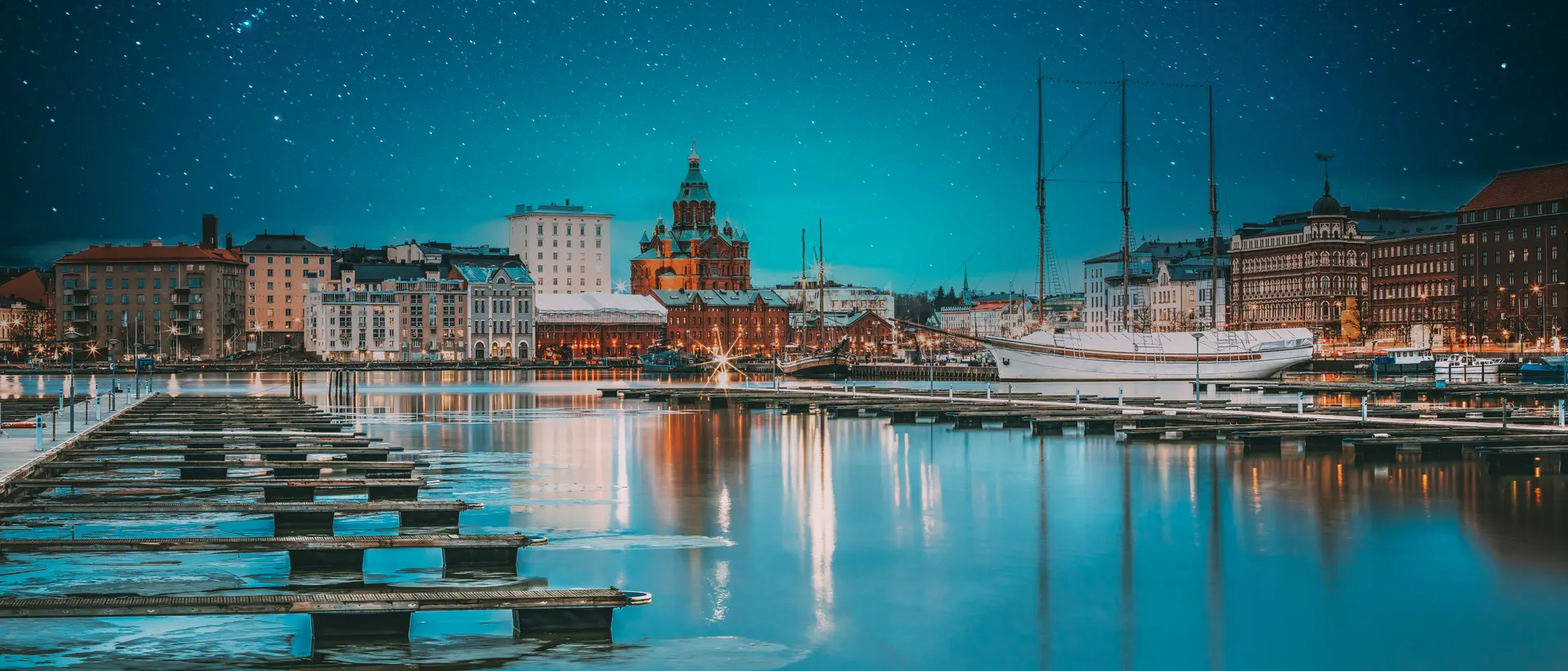 View Of Evening City And Uspenski Cathedral From Pier. Light Blue Dramatic Sky. Azure Color Sky