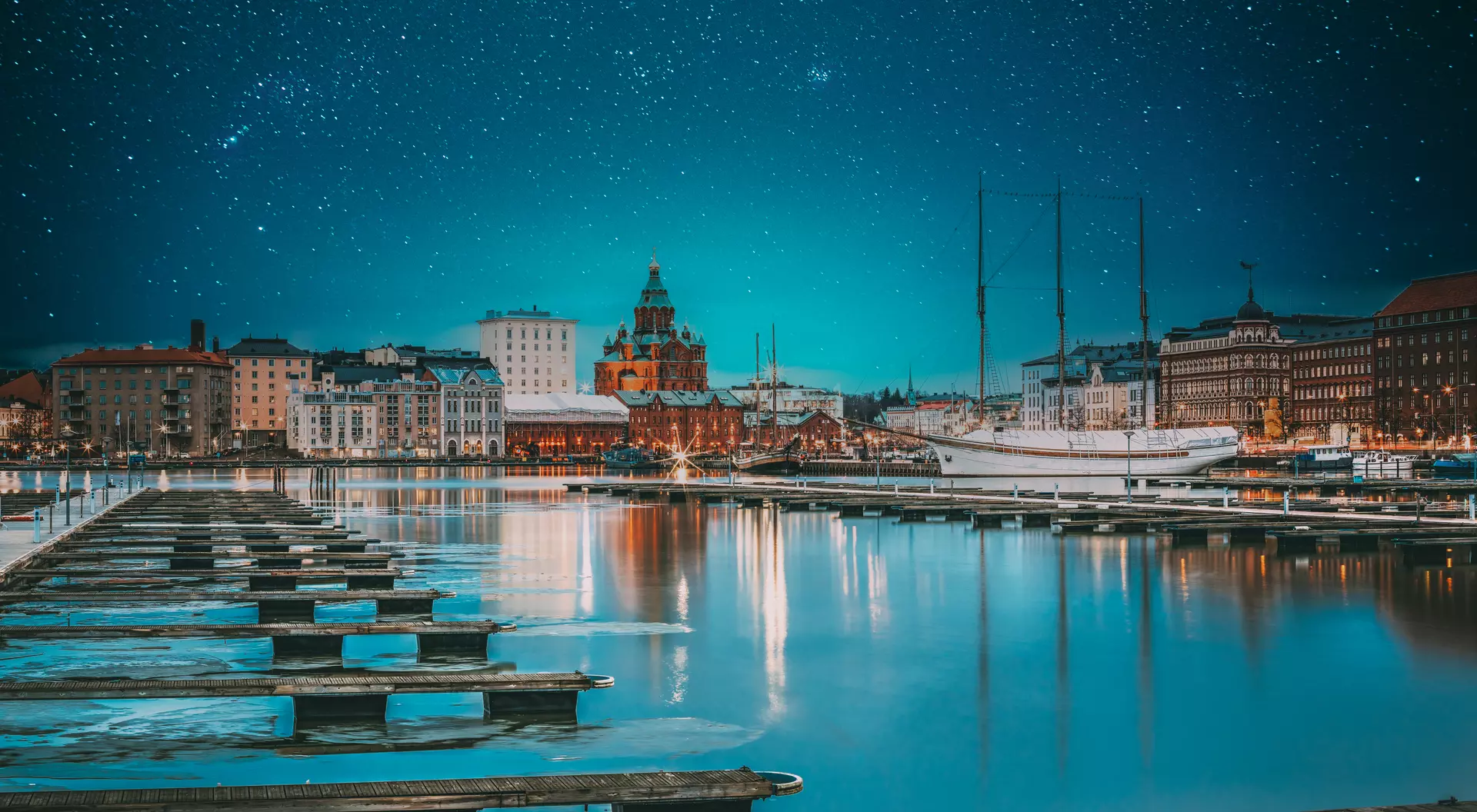 View Of Evening City And Uspenski Cathedral From Pier. Light Blue Dramatic Sky. Azure Color Sky