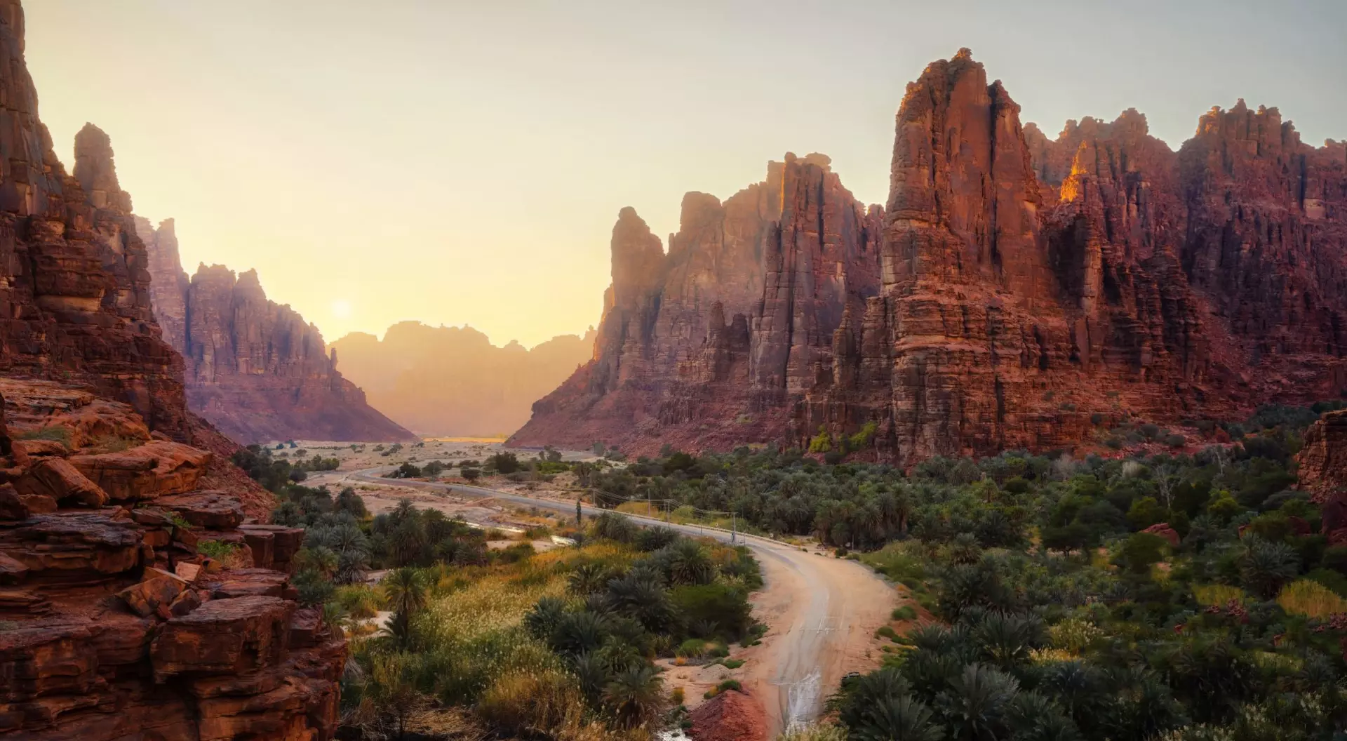 Sunrise over canyon, river winding through