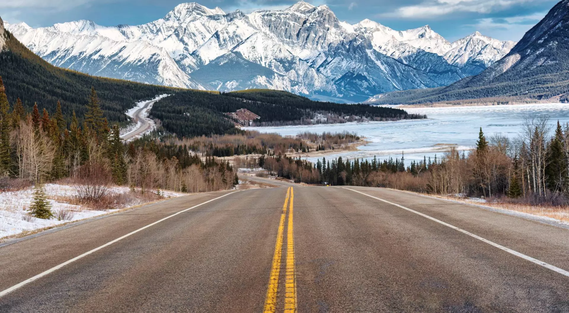 Icefields Parkway, Alberta Beautiful scenery of Road trip on highway with rocky mountains and frozen lake