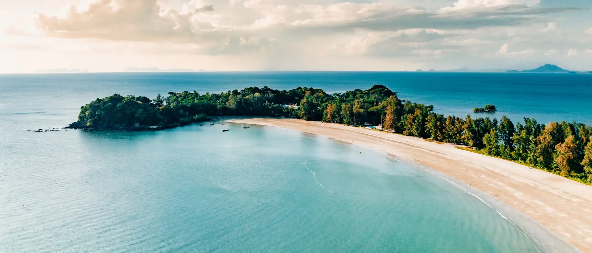 Laem Kho Kwang Beach, Sala Dan, Koh Lanta, Krabi Aerial point of view towards the island bay and coast under sunny blue summer sky.