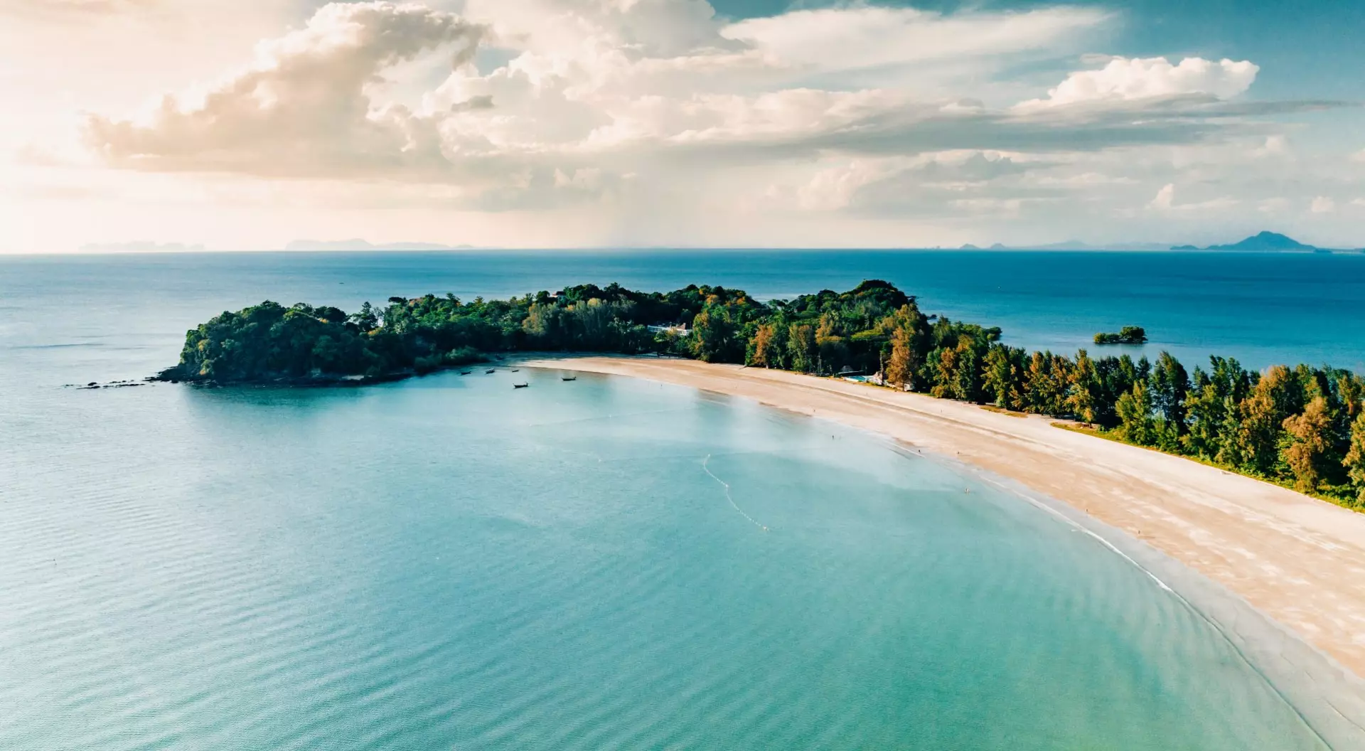 Laem Kho Kwang Beach, Sala Dan, Koh Lanta, Krabi Aerial point of view towards the island bay and coast under sunny blue summer sky.