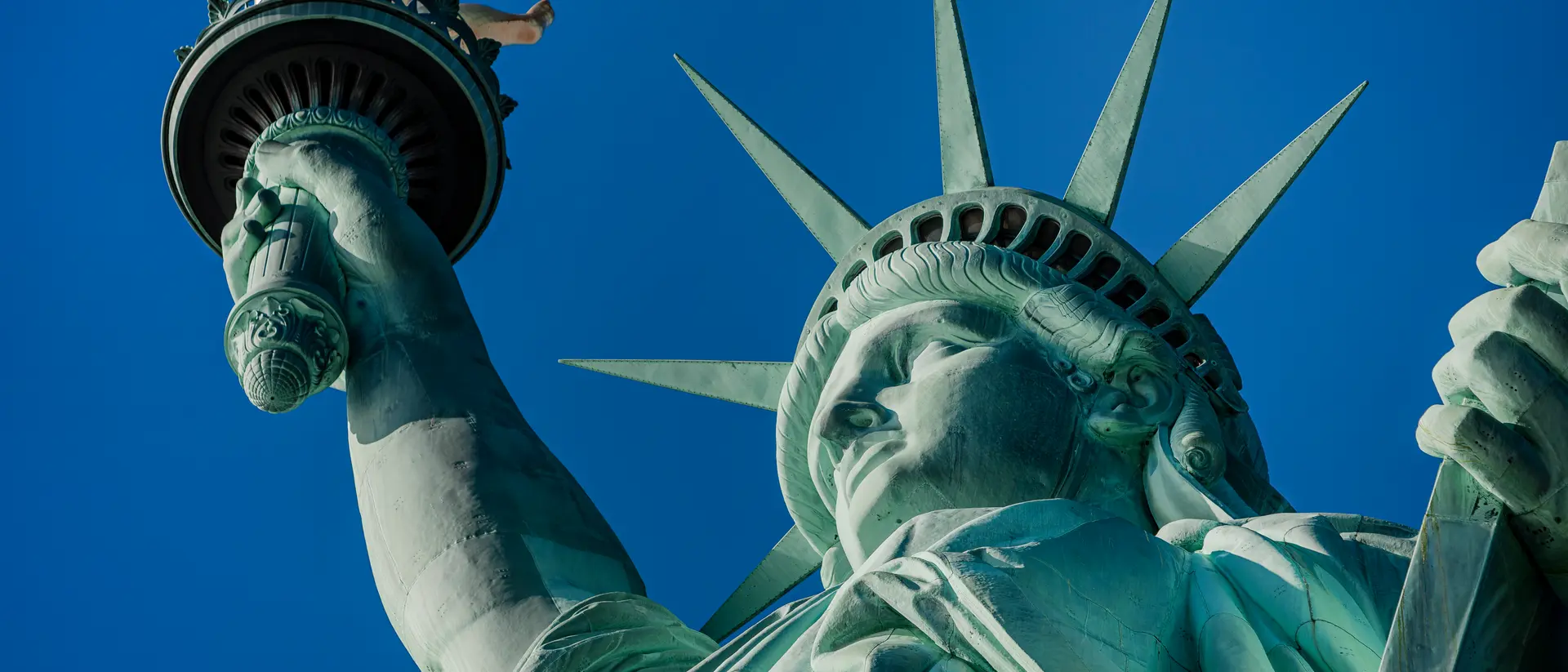New York Statue of Liberty in a blue summer sky. Landmark of New York Blue sky
