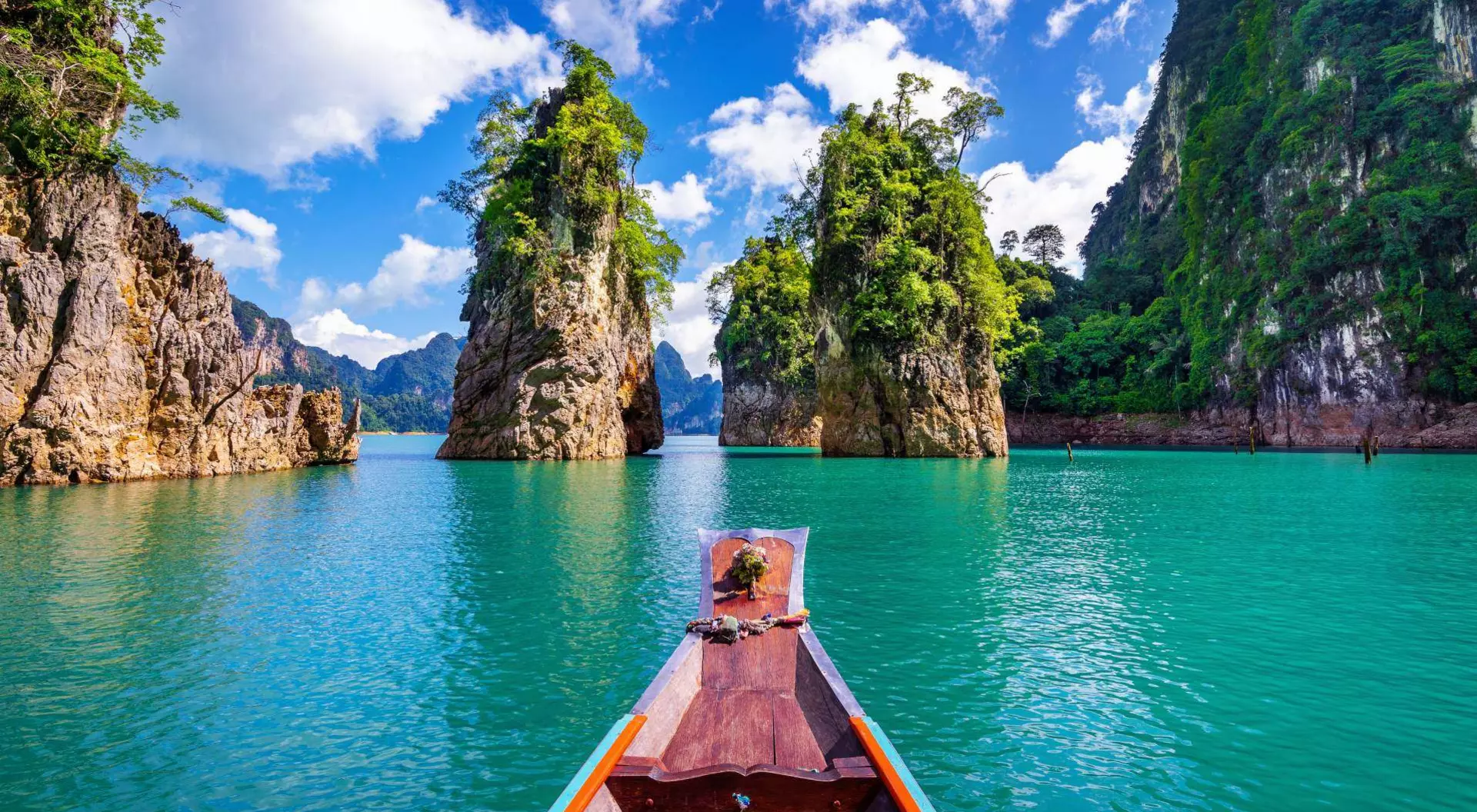 Mountains and view from aboard a boat on the Phrasaeng river