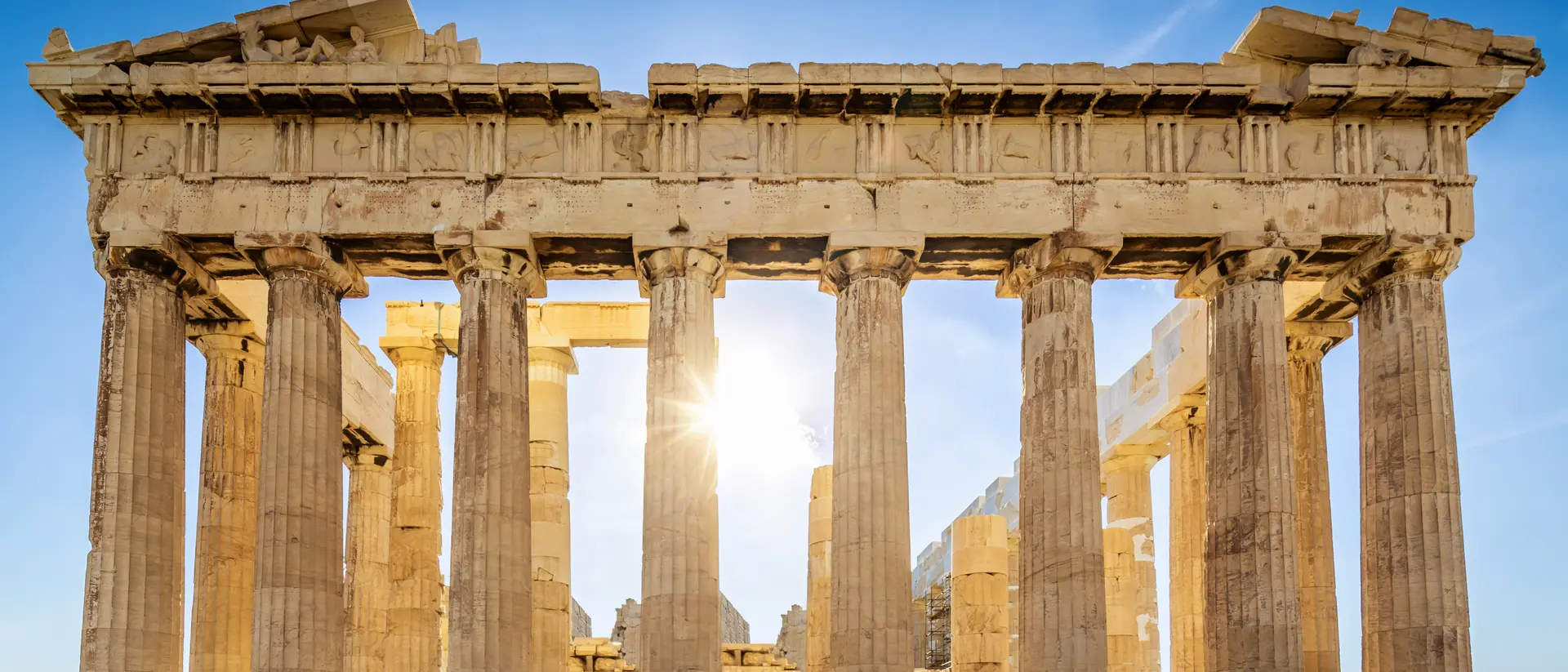 The Parthenon on the Athenian Acropolis, Sun shining through the columns. The Temple is dedicated to the Greek Goddess Athena.