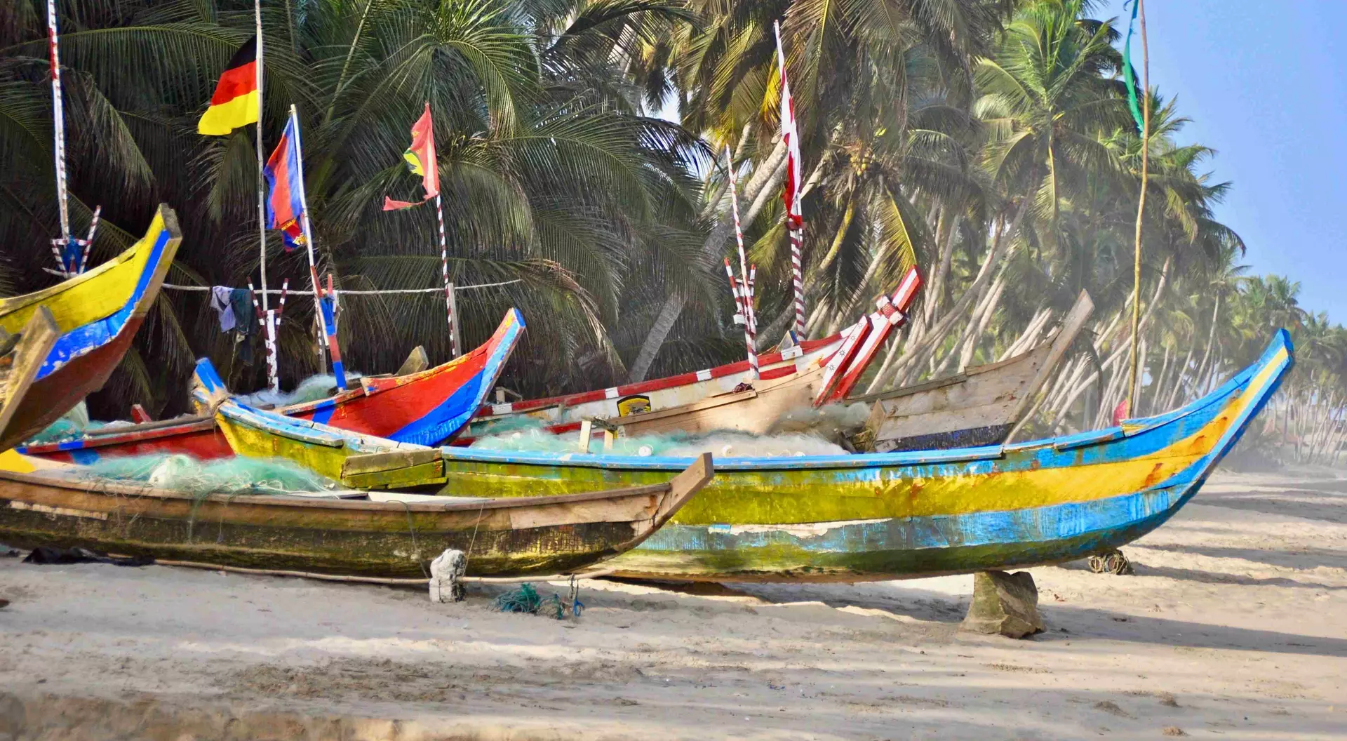 Traditional wooden fishing boats (pirogues) moored at the beach