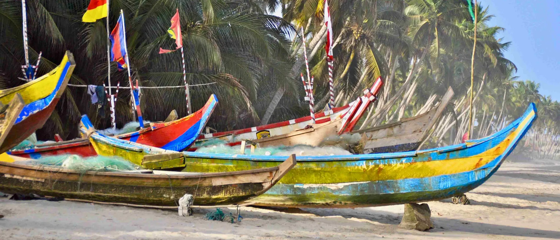 Traditional wooden fishing boats (pirogues) moored at the beach