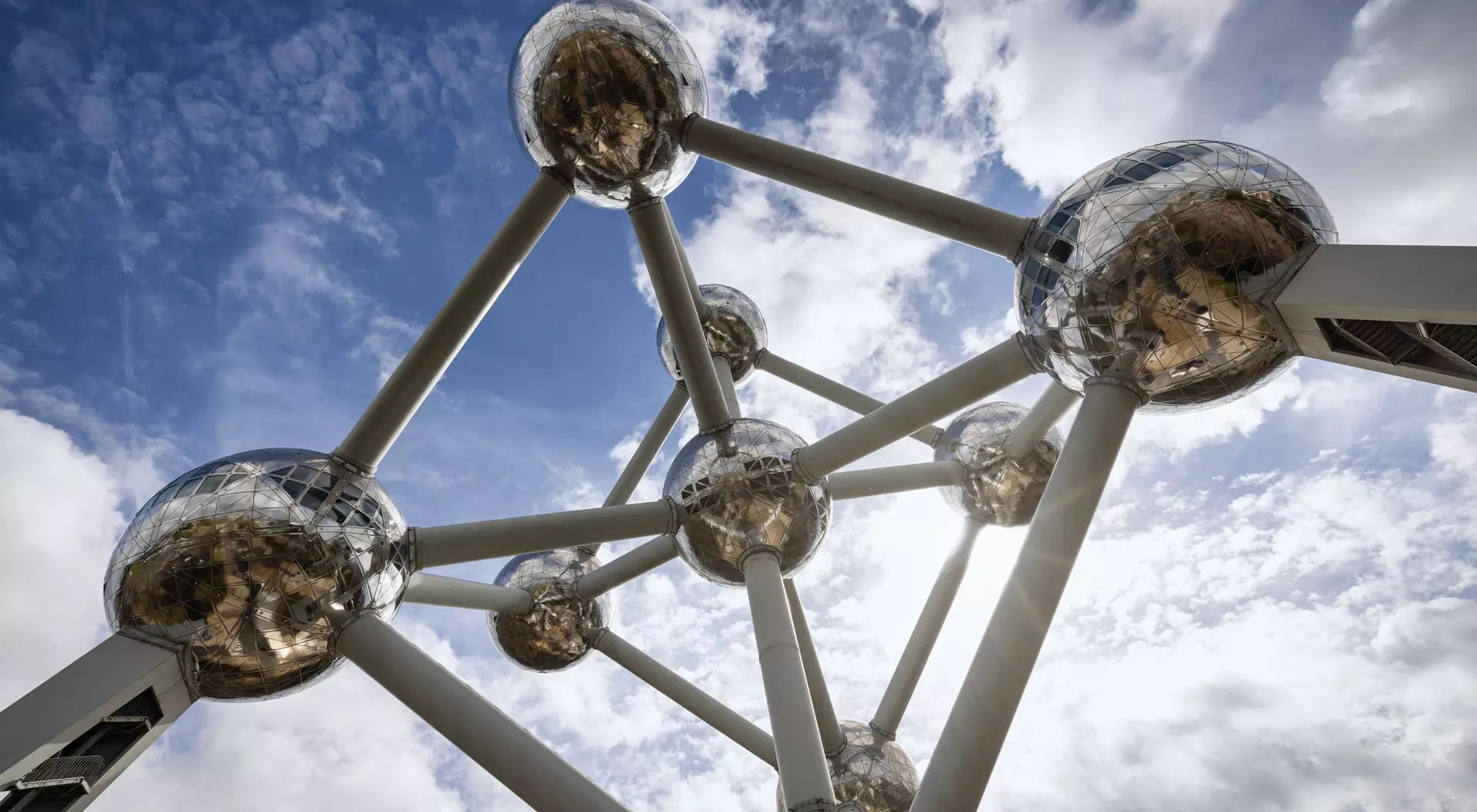 Belgium The Brussels Atomium Monument from below under blue summer sky.