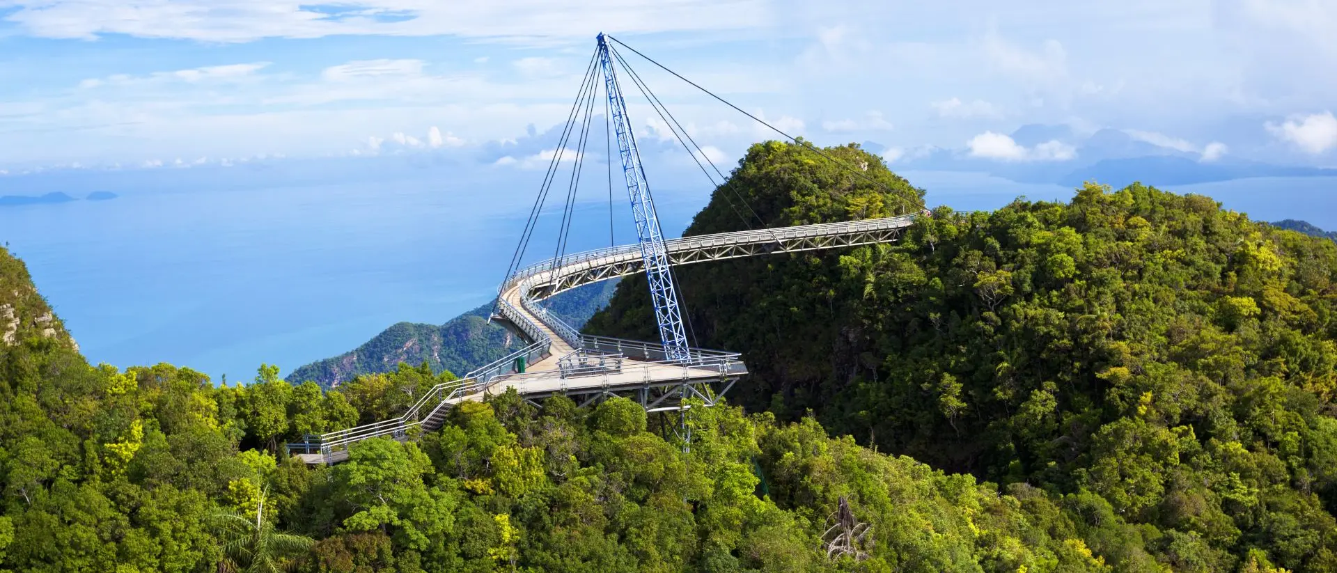 Amazing cable bridge over the tropical rainforest island landscape