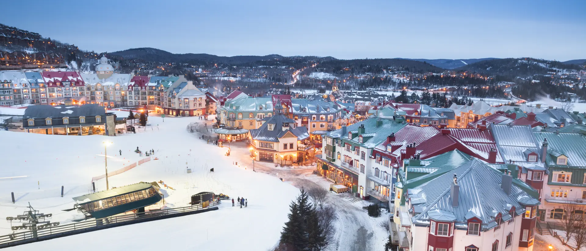 Ski lifts in the snowy Mont Tremblant village and mountainscape