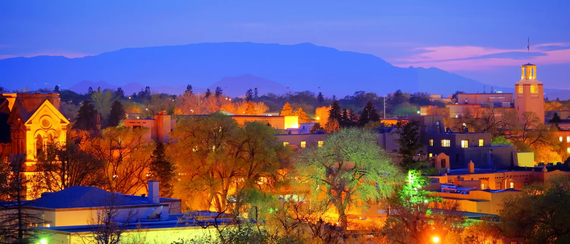 Santa Fe, New Mexico Cityscape at twilight, mountains in the background