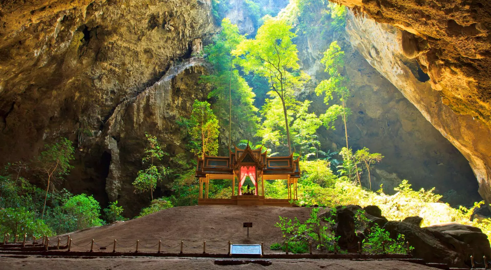 Khao Sam Roi Yot National Park Sunlight shines down through Phraya Nakorn cave hole on pavillion of the king, Sam Roi Yot National Park