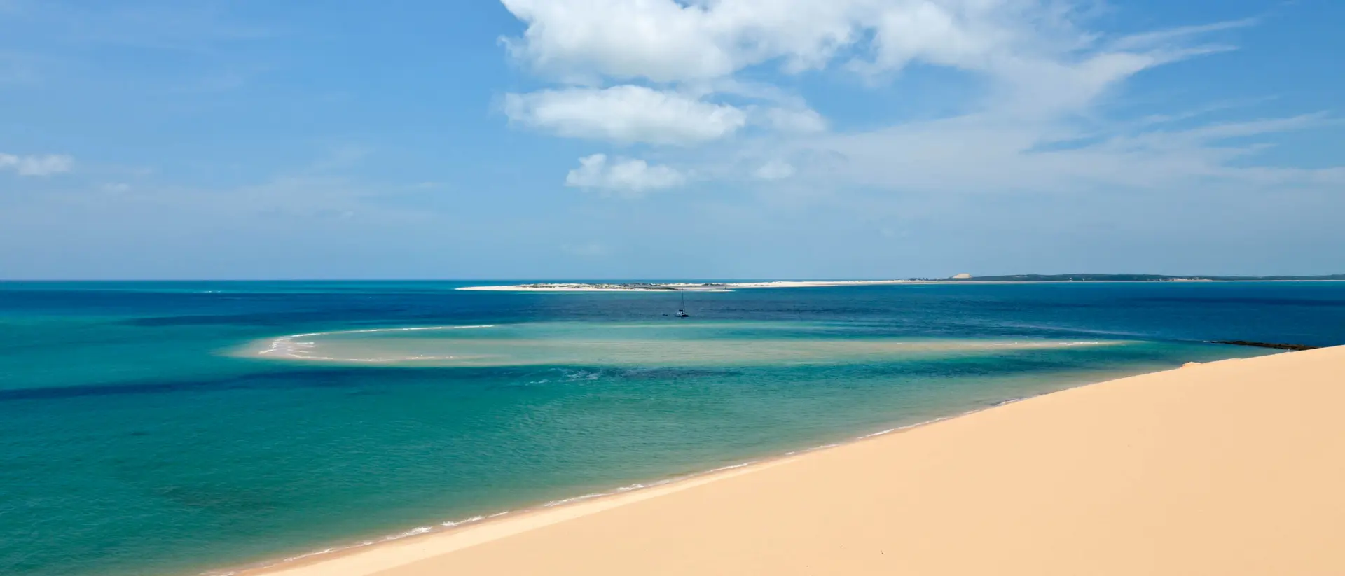 Pemba, Mozambique View from a sandune in the Bazaruto archipelago Mozambique with a luxury yacht lying at anchor below.