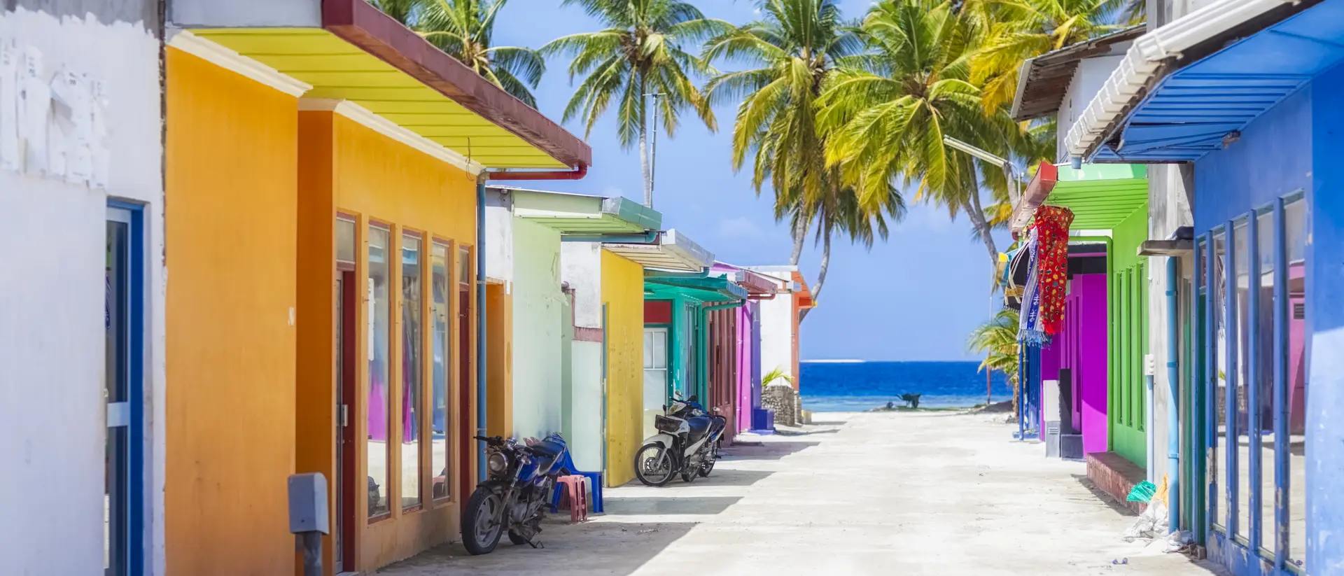 Colorful houses in Maafushi Island Shopping street with typically colorful house facades in Maafushi a local island in the Maldives.